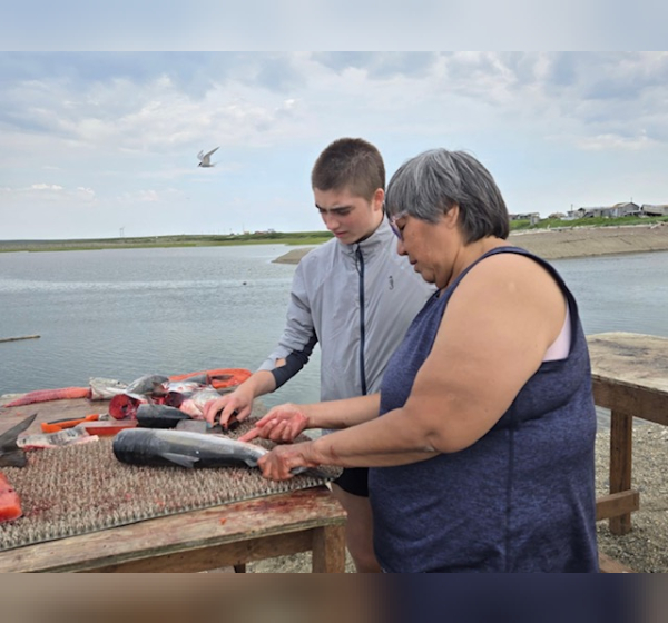 Annette teaching me how to cut salmon for drying