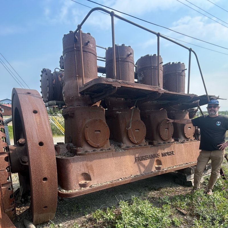man by old engine