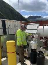 man filling propane